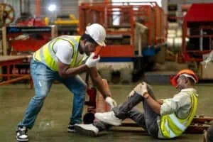 construction worker receiving first aid illustrating accident insurance coverage