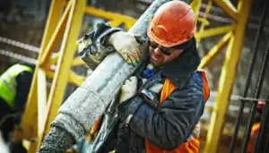 Construction workers performing different tasks on the same site