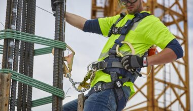Construction workers wearing safety gear on an active job site