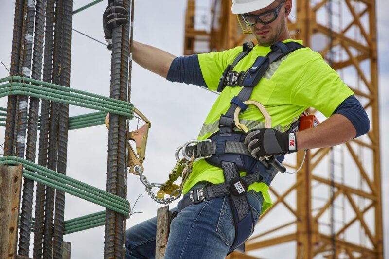 Construction workers wearing safety gear on an active job site